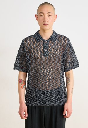 Short-sleeve polo shirt in black and gray knit, featuring a wavy pattern, two buttons, and a textured fabric with sheer sections.
