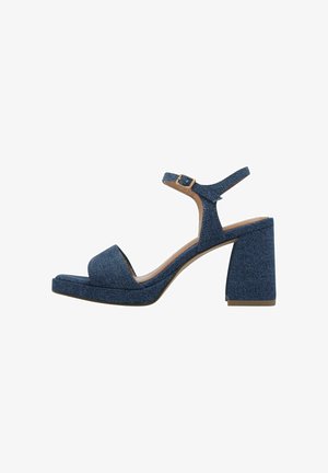 Denim block-heeled sandals with an ankle strap, open toe, and a textured blue fabric upper. Features a chunky heel for stability.