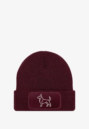 Maroon knit beanie with a ribbed texture and a fold-over cuff. Features a rectangular patch with a white dog silhouette design.