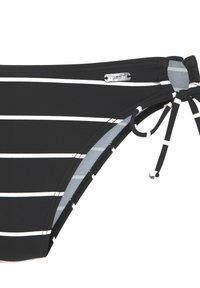 Schwarz-weiß gestreifter Bikiniunterteil mit seitlichen Bindebändern. Hergestellt aus glattem Stoff mit glänzendem silbernen Logodetail.