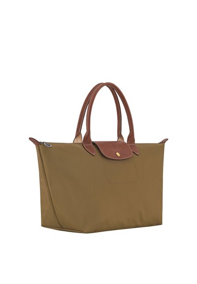 Brown tote bag with double handles and a small flap with a gold button on a plain white background.