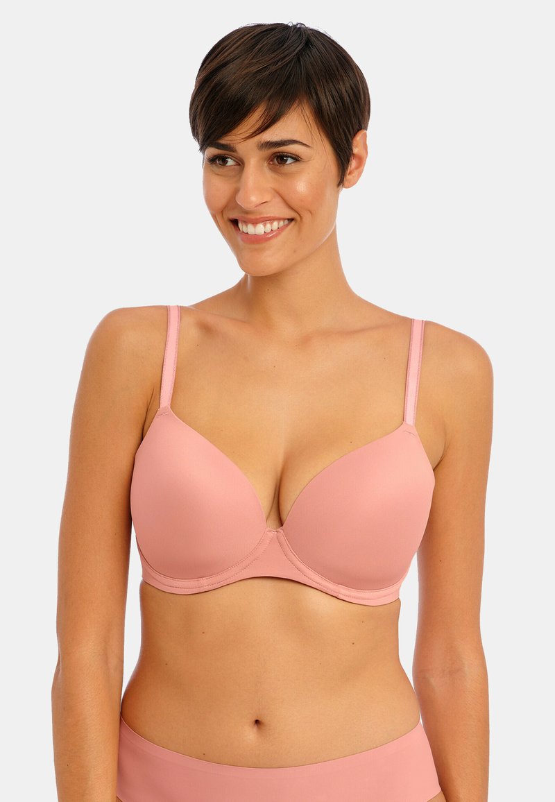 Soutien-gorge rembourré rose clair avec armatures, en tissu lisse, bretelles réglables et un design plongeant. Sans couture avec un style minimaliste.