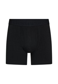 Black boxer shorts made of soft fabric, featuring a branded elastic waistband, stitched seams, and a snug fit design.