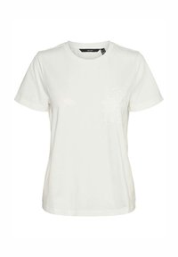 T-shirt en coton blanc avec un col rond, des manches courtes et un détail de poche en dentelle texturée sur la poitrine gauche. Tissu lisse.