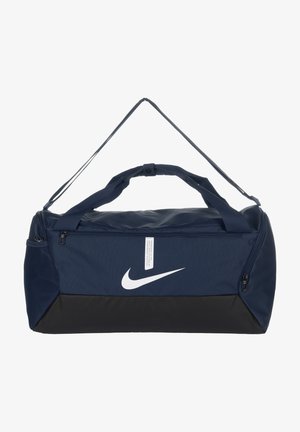 Borsa a sacco blu navy con fondo nero, chiusura con zip, manici doppi e logo Nike bianco sulla parte anteriore.