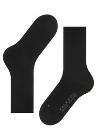 Calzini neri in cotone con una texture liscia, caratterizzati da una cintura a coste e punte rinforzate. Nome del marchio "FALKE" e taglia stampati sulla suola.