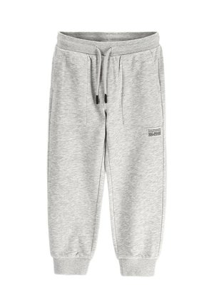 Light gray knit sweatpants with front patch pockets, elastic waist with drawstring, ribbed ankle cuffs, and small black printed text on right leg.