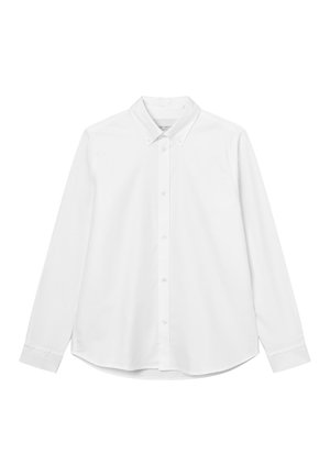 Chemise blanche à manches longues avec un col boutonné, fermeture par boutons à l'avant et ourlet arrondi. Texture lisse sans motifs.