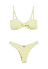 Yellow ribbed bikini set featuring a bandeau top with a front knot and adjustable straps, paired with a matching high-cut bottom.