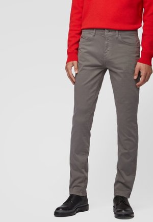 Gray cotton pants with a slim fit, featuring a front button and zipper closure, side pockets, and subtle stitching details.