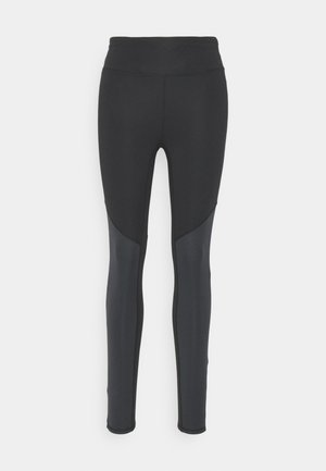 Leggings sportivi neri con una vita alta, forma aderente e pannelli laterali più scuri a contrasto. Tessuto liscio e elasticizzato con un design semplice.