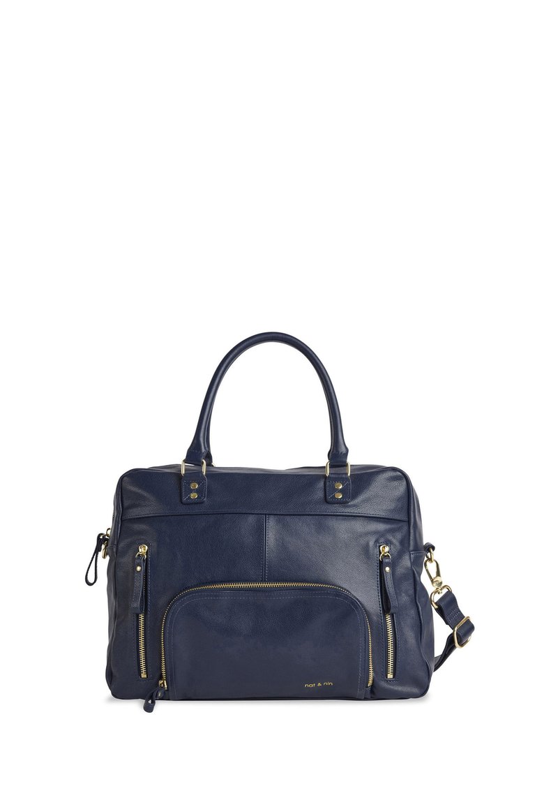 Navy leather bag featuring dual handles, gold-tone hardware, two front zip pockets, and a detachable shoulder strap. Smooth texture.