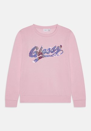 Ljusrosa sweatshirt med rund hals, prydd med en glittrig blå och lila "Glassy" textdesign på framsidan. Mjuk textur, ribbade ärmslut.