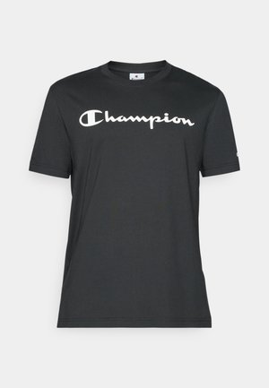 Black cotton t-shirt featuring short sleeves and a round neckline. It has a white "Champion" logo printed across the chest.