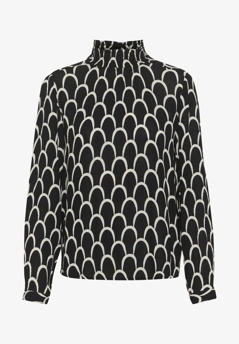 Blusa a maniche lunghe bianca e nera con collo alto, caratterizzata da un motivo a scallop ripetuto e un tessuto morbido e testurizzato.