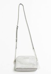 Silver glitter crossbody bag with a curved shape, chain and strap handle, and a smooth, shiny texture. Features subtle logo accent.