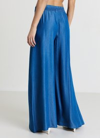 Calliope GONNA - Jeans a zampa - blu denim medio