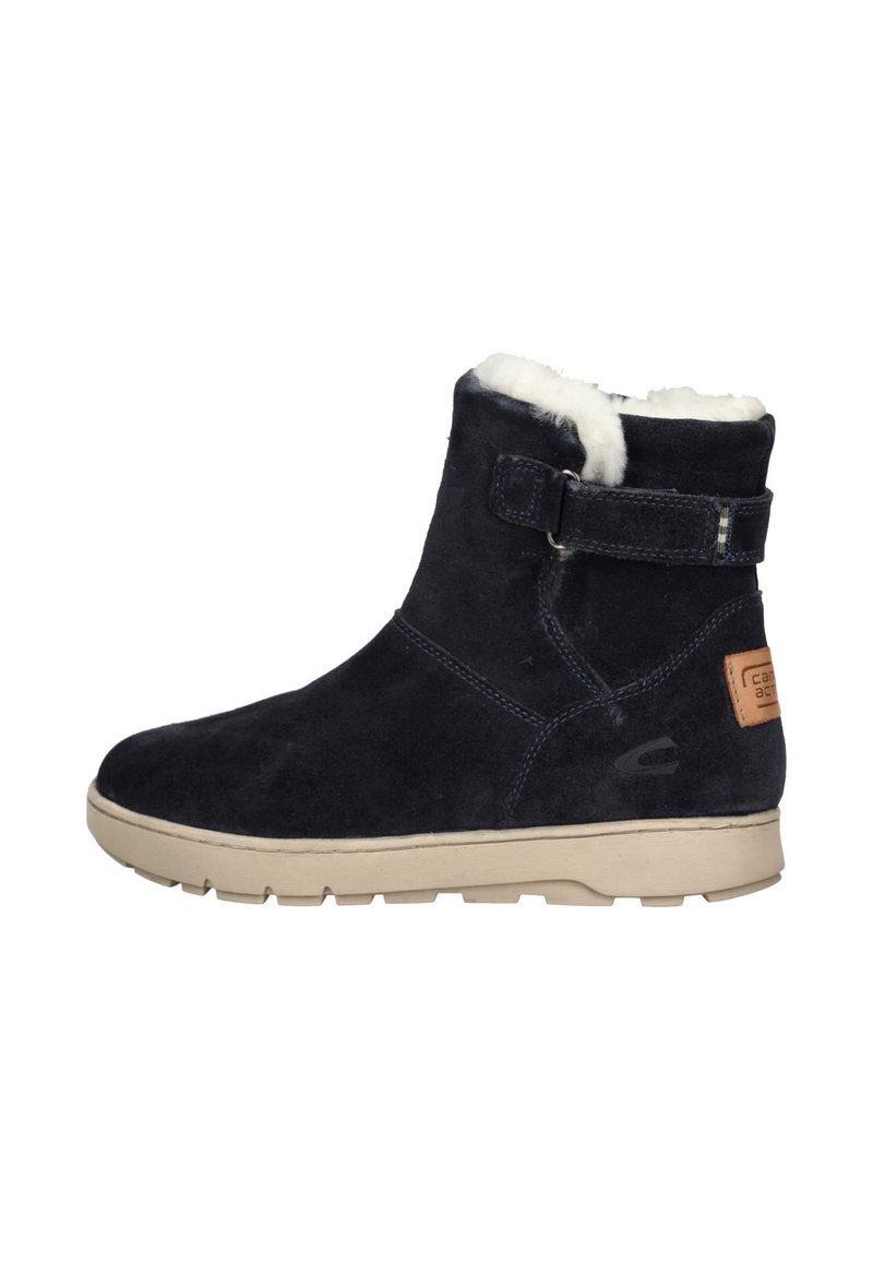 Navy suede ankle boot with faux fur lining, flat beige rubber sole, adjustable strap, and contrasting stitching detail.