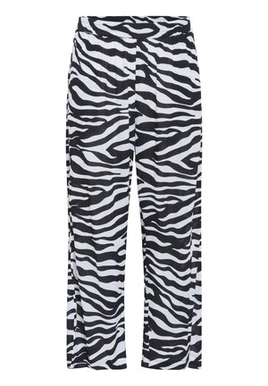Pantalon en imprimé zèbre noir et blanc avec une taille élastique, des jambes larges et un tissu léger et texturé.