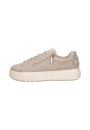 Beige low-top sneaker with lace-up front, gold zipper detail, textured heel panel, and thick white sole displayed on white background.