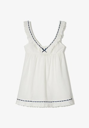 Rochie albă fără mâneci, cu decolteu adânc în V, garnitură din dantelă cu volane și accente de panglică bleu marin; are talie strânsă și tiv zimțat.