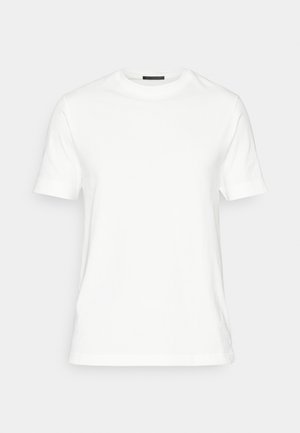 Hvid bomulds T-shirt med korte ærmer, rund halsudskæring og en glat tekstur. Har et enkelt design uden mønstre eller accenter.