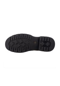Black rubber footwear sole with a textured pattern, featuring deep grooves and hexagonal shapes for traction. Sturdy and durable design.