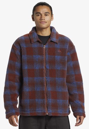 Fleecejacke mit einem braun-blauen Karomuster, mit Reißverschluss, spitzem Kragen und strukturiertem Stoff für zusätzliche Wärme.