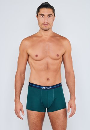 Boxer verde in cotone, con una fascia in vita blu navy con il logo "JOOP!" e strisce di accento blu sulla fascia.