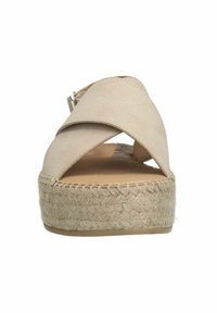 Sandale espadrille à lanières croisées beige avec une semelle en jute tissée, dotée d'une tige texturée et d'une boucle métallique réglable.