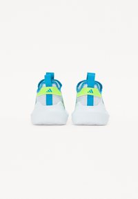 Sport shoes in white mesh with blue and neon green accents. Features a rounded silhouette and back pull tabs for easy wear.