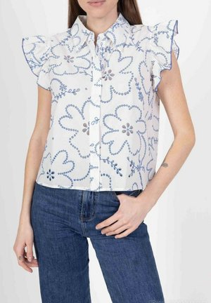 Chemise blanche à manches courtes avec imprimé floral bleu et détails froncés aux épaules. Dotée de boutons sur le devant et d'un col rabattu.