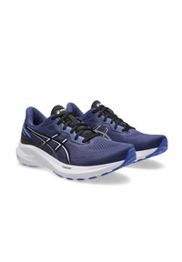 Scarpe da corsa blu navy con tomaia in rete traspirante, lacci neri e suola bianca. Presentano dettagli in argento e tecnologia FlyteFoam.