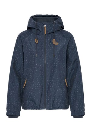 Marineblå hættejakke med hvide polkaprikker, forreste lynlås, snøre i hætten og lynlåslommer i siderne med brune trækflapper.