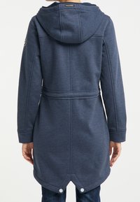 Navy blue hooded coat with a cinched waist, long sleeves, and decorative buttons at the hem. Features a soft, textured fabric.
