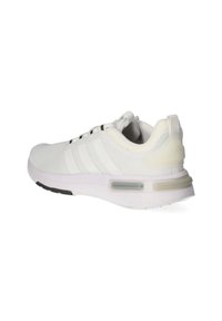 White athletic shoe with mesh upper, three black stripes, and a cushioned sole. Features a semi-transparent accent at the heel.