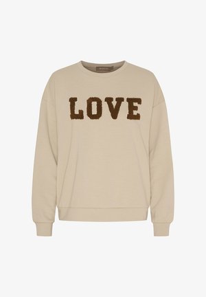 Beige langærmet sweatshirt med brunt, tekstureret "LOVE"-tekst tværs over brystet, rund halsudskæring samt ribstrikkede ærmeender og kant.