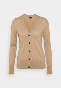 Beige stickad cardigan med långa ärmar, V-ringad och sex mörkbruna knappar framtill. Har ribbade ärmslut och nederkant. Mjuk textur.