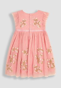 Robe rose avec broderies florales, manches courtes à volants et fermeture à boutons au dos. Fabriquée en tissu doux avec une jupe froncée.
