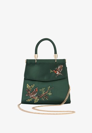 Roheline satiinhang, millel on tikandiga linnu disain, ülemine käepide ja kuldne kettrihm. Omab klappkinnitust ja dekoratiivset õmblust.