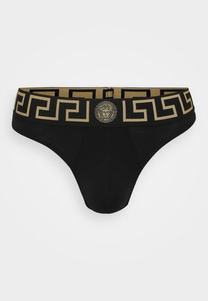 Brief de bikini noir avec une taille ornée d'un motif doré, affichant un logo Méduse et des accents géométriques, fabriqué à partir d'un tissu doux et extensible.