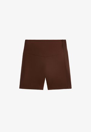 Pantaloni sportivi marroni realizzati in tessuto liscio. Presentano una vita alta e tasche nascoste, con una sottile texture a coste lungo i lati.