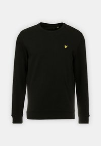 Sudadera negra de algodón, con mangas largas, cuello redondo y un pequeño logo amarillo bordado en el pecho.