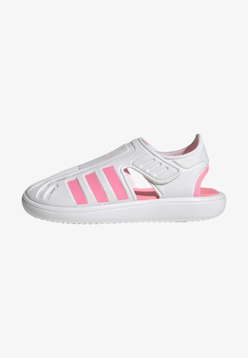 White slip-on sandals with pink accents and three pink stripes. Features cut-outs for ventilation and a textured rubber sole.