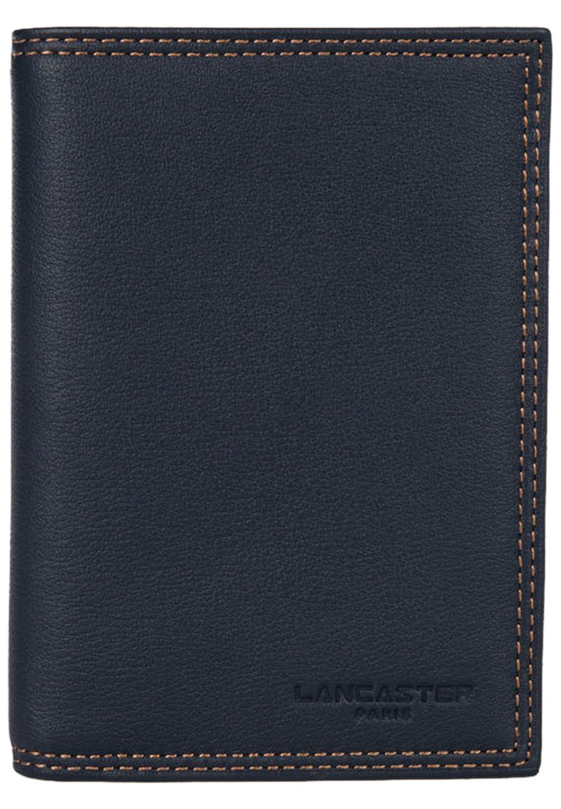Navy leather wallet with smooth texture, contrasted by brown stitching. Features embossed branding at the bottom right. Compact, rectangular shape.