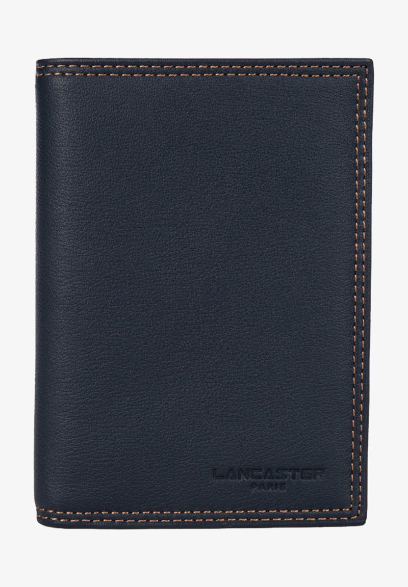 Navy leather wallet with smooth texture, contrasted by brown stitching. Features embossed branding at the bottom right. Compact, rectangular shape.