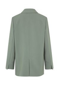 Bakview av en lys grønn blazer, med spiss krage, lange ermer, og rett snitt med midtseam og sidelommer.