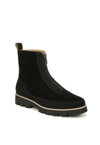 Black suede ankle boots with a front zipper, contoured silhouette, textured finish, and a thick, rugged black rubber sole with beige stitching.