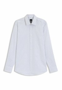 Camicia bianca a maniche lunghe con un motivo decorato da piccoli grembiuli blu. Colletto a camicia e vestibilità regolare con maniche a polsino.