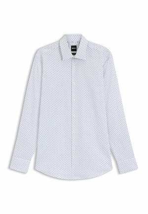 Chemise blanche à manches longues présentant un motif avec de petites formes bleu marine. Col boutonné et coupe regular avec des manches à poignets.